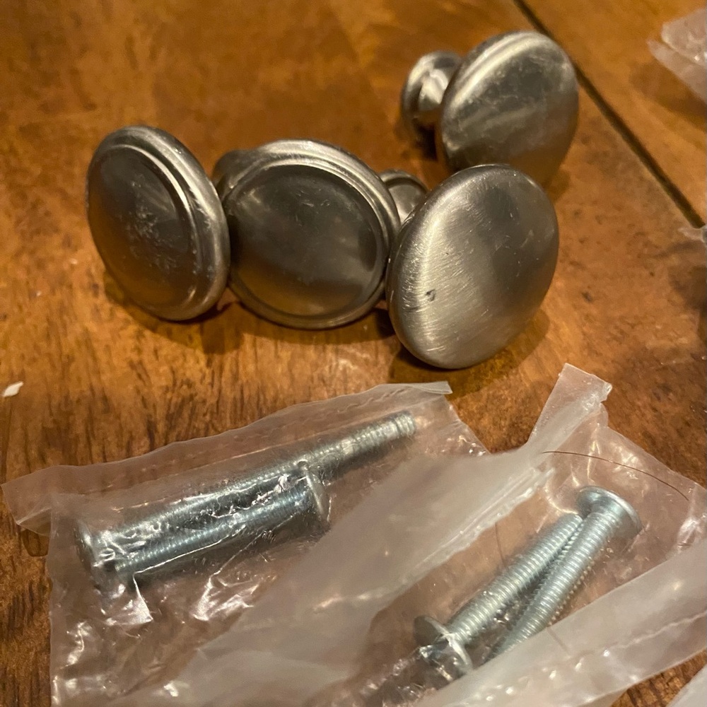 Set of 4 stainless steel draw pulls .